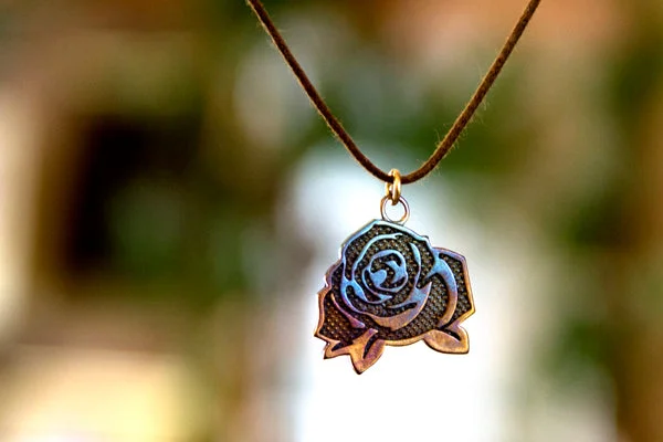 Shop Jewelry That Shines Without The High Price Mighty Rose Filled-In Pendant Necklace in Iridescent Finish on Adjustable Natural Fiber Cord Shop Jewelry That Shines Without The High Price Mighty Rose Filled-In Pendant Necklace in Iridescent Finish on Adjustable Natural Fiber Cord